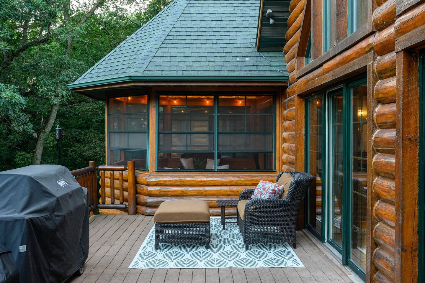 The deck and sunroom at Hickory Hill, set in the trees