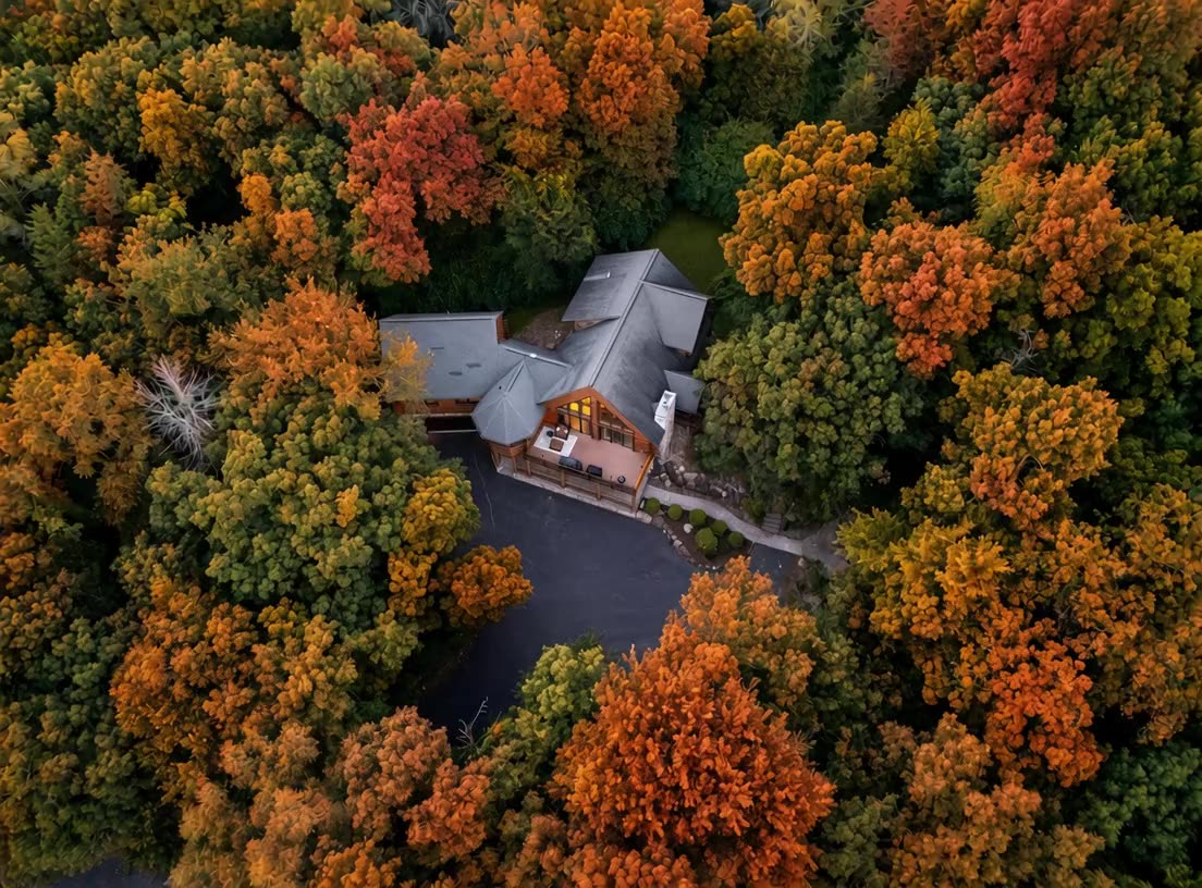 Hickory Hill from above, the woods around it turning fall colors